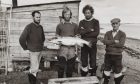 George Chamier (second from left, holding fish) spent 12 years full-time net and coble fishing on the Cromarty Firth.