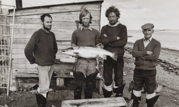 George Chamier (second from left, holding fish) spent 12 years full-time net and coble fishing on the Cromarty Firth.