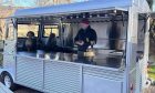 Glencoe food truck Kitchen is silver and in a retro style.