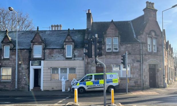 Police car outside property on Tomnahurich Street in Inverness