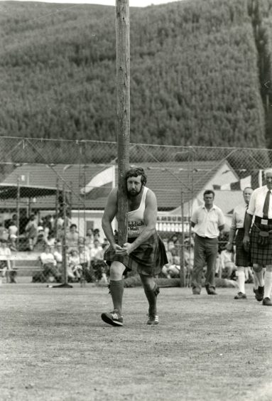 Alan Sim tossing the caber