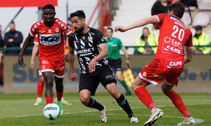 Kortrijk's Kings Kangwa, Charleroi's Oday Dabbagh (centre) and Kortrijk's Felipe Avenatti fight for the ball. Image: Shutterstock.