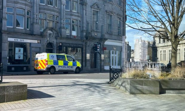 Police wait at the Union Terrace junction. Image: Isaac Buchan/DC Thomson