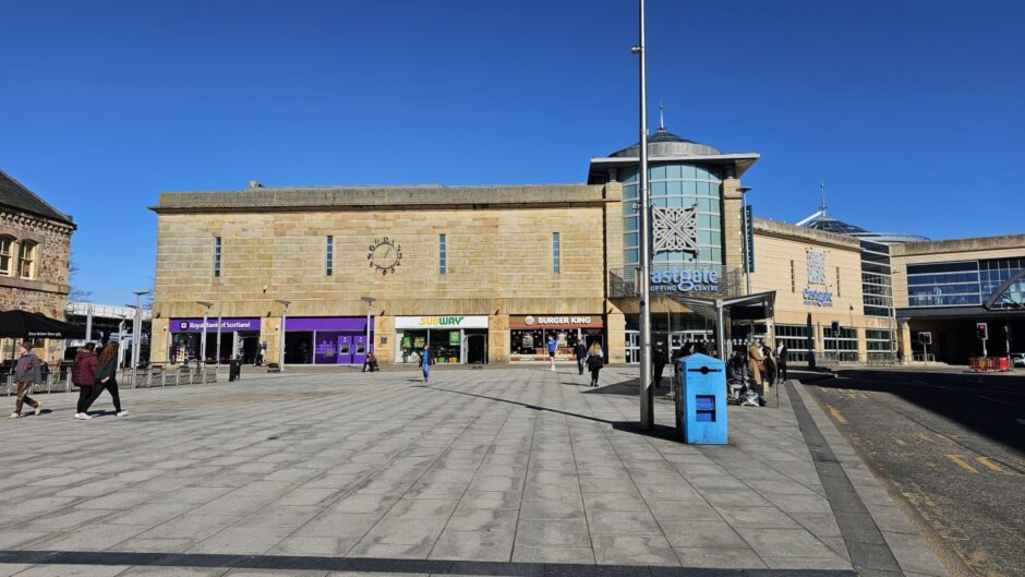 Landscape view of Falcon Square with the Eastgate Shopping Centre ahead and the bank on the left corner of the building.