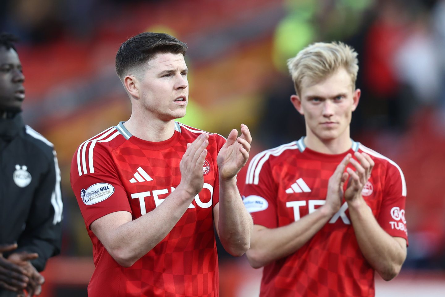 Aberdeen striker.Kevin Nisbet and Alexander Jensen (right) applaud fans after the 2-2 draw with Dundee United at Pittodrie. Image: Shutterstock 