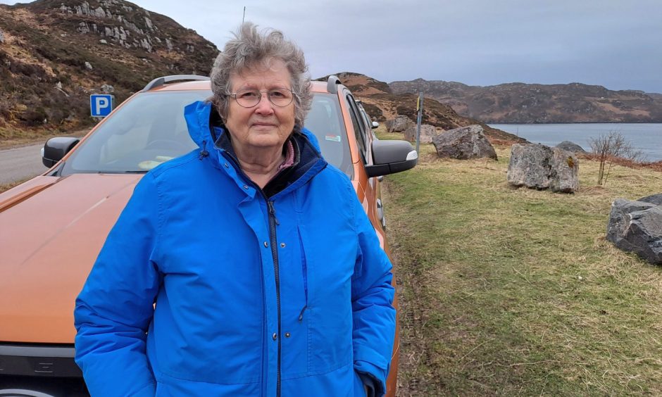Margaret Meek at a lay-bye outside Kinlochberviw. She wants the North Coast 500 route to be "wound down". 