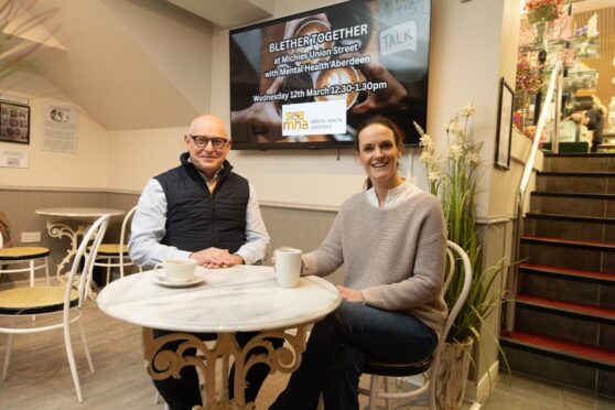 Graeme Kinghorn from Mental Health Aberdeen with Rosemarie Michie, manager at Michies Pharmacy, at their Union Street branch. Image: Paul Reid.