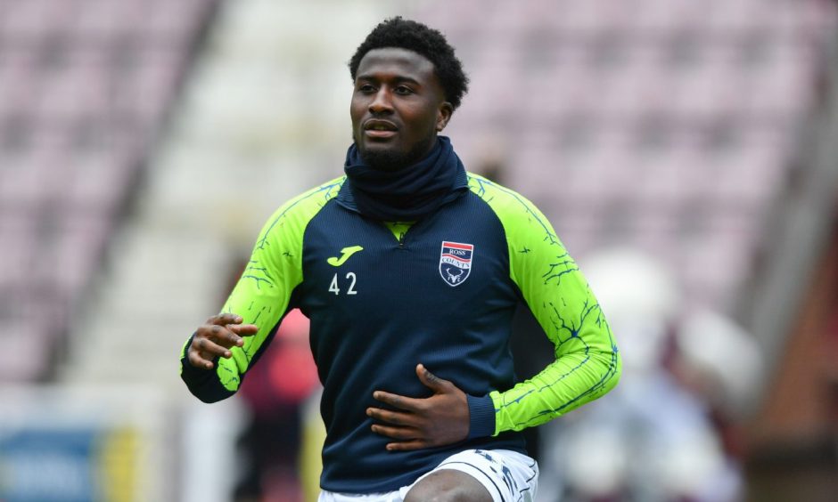 Ross County midfielder Nohan Kenneh warming up at Tynecastle Park, Edinburgh.