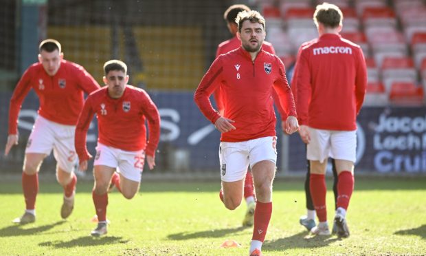 Ross County's Connor Randall warming up ahead the Premiership match against Kilmarnock. Image: SNS.