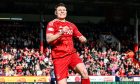 Aberdeen's Kevin Nisbet celebrates as he scores the opener in the 4-1 Scottish Cup quarter-final win against Queen's Park at Pittodrie. Image: SNS