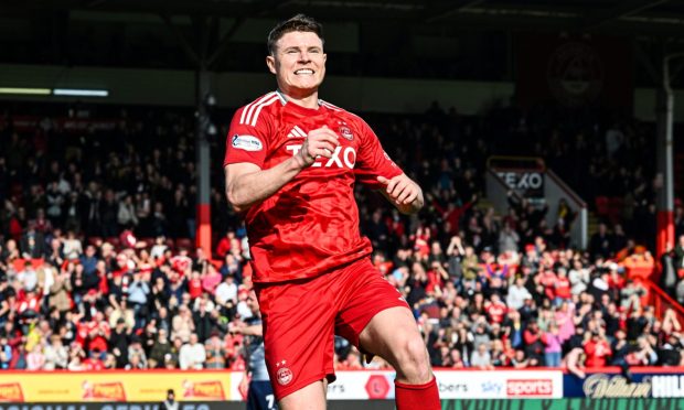 Aberdeen's Kevin Nisbet celebrates as he scores the opener in the 4-1 Scottish Cup quarter-final win against Queen's Park at Pittodrie. Image: SNS