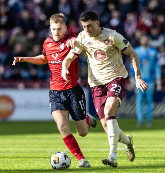 Ross County's Kieran Phillips and Hearts' Lewis Neilson.