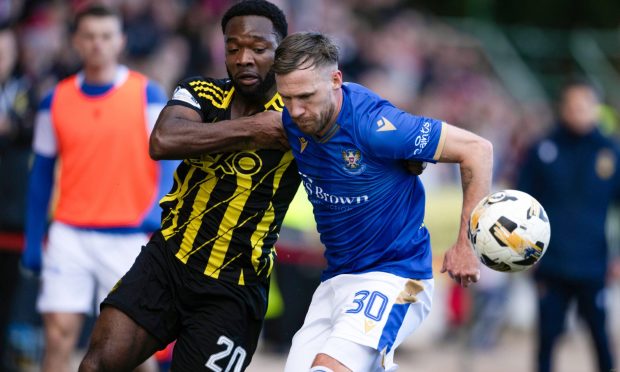 Aberdeen's Shayden Morris and St. Johnstone's Barry Douglas in action during the 0-0 draw.  Image: SNS.