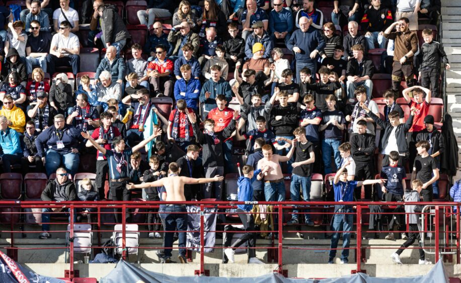 Around 500 Ross County fans backed their team in the SPFL Premiership match against Hearts at Tynecastle Stadium, Edinburgh, on March 15, 2025. Here is a general view of a main section of their support. 