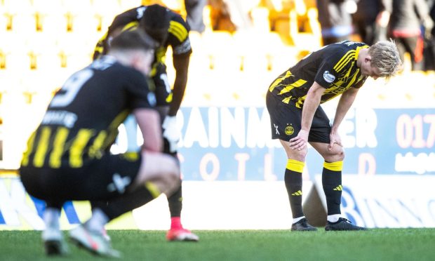 Aberdeen's Alexander Jensen (R) looks dejected at full time during after the 0-0 Premiership draw with St Johnstone in Perth.