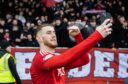 Aberdeen's Alfie Dorrington takes a selfie at full time of the 4-1 win against Motherwell. Image: SNS