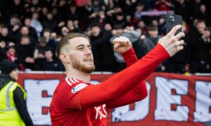 Aberdeen's Alfie Dorrington takes a selfie at full time of the 4-1 win against Motherwell. Image: SNS