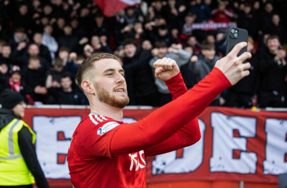 Aberdeen's Alfie Dorrington takes a selfie at full time of the 4-1 win against Motherwell. Image: SNS