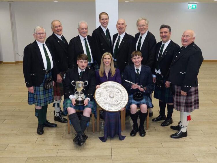 Iain Macpherson with his male voice choir and Joy Dunlop.