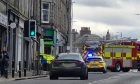 Police cars and a fire engine on Rosemount Place in Aberdeen.