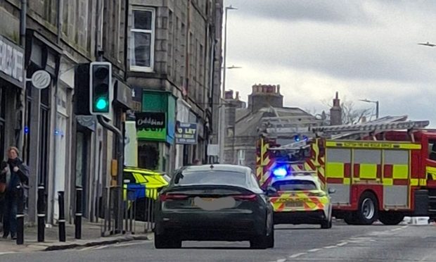 Police cars and a fire engine on Rosemount Place in Aberdeen.