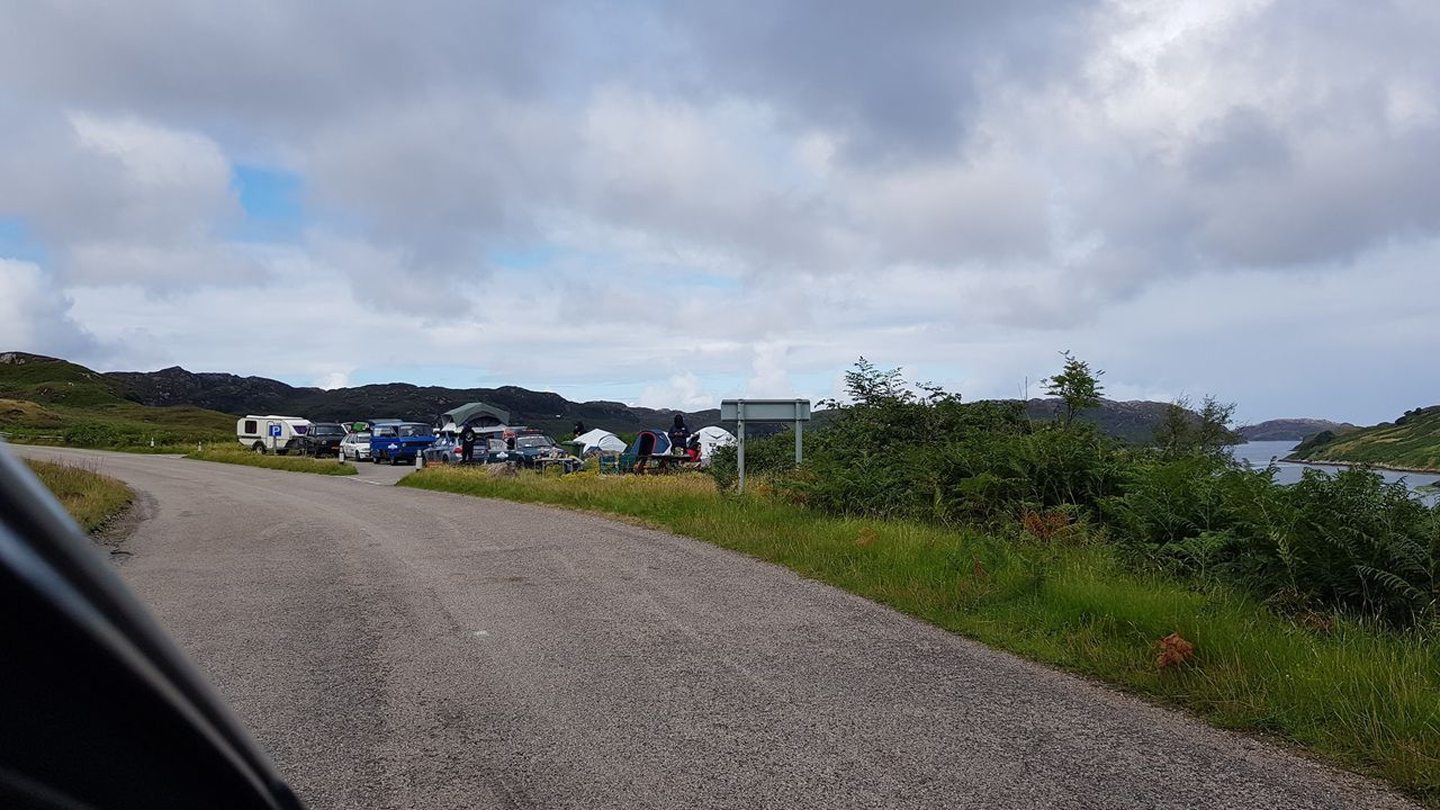 many vehicles parked in lay-by outside Kinlochbervie