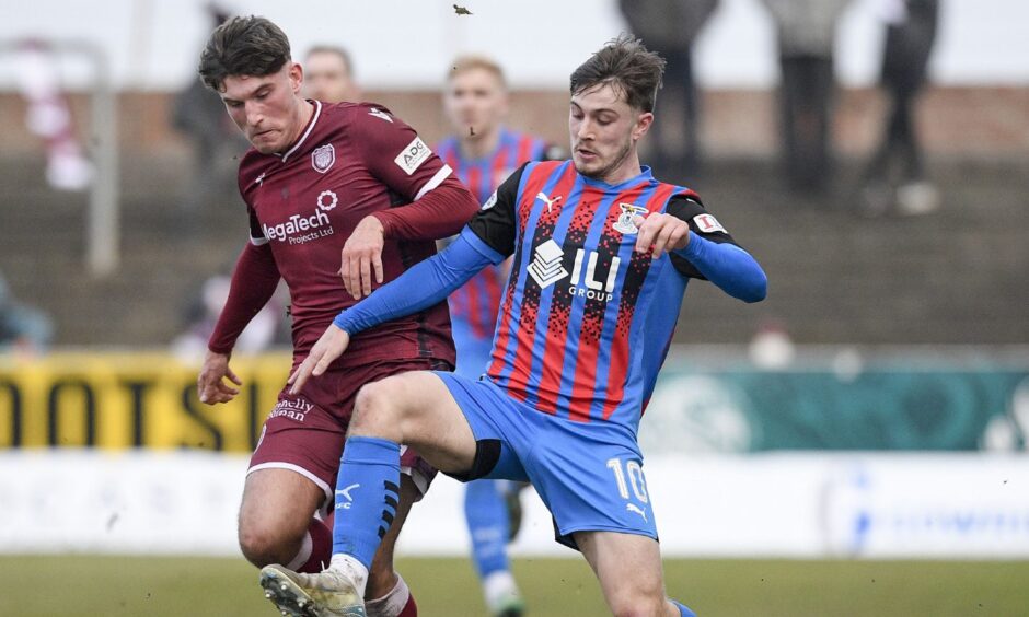 Alfie Bavidge (Inverness) tussles with Ali Spalding (Arbroath) during a Scottish League One match. Image: Dave Johnston