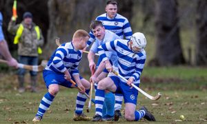 Caberfeidh's Craig Morrison with the Newtonmore defence of Cameron McNiven (left) and Rory Kennedy. Image: Neil Paterson.