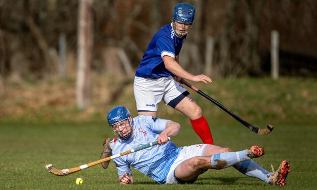 Caberfeidh's Logan Beaton falls in the challenge with  Somhairle Thomson (Kyles). Image: Neil Paterson.