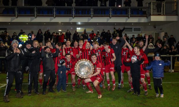 Fraserburgh's players and management celebrate with the Morrison Motors (Turriff) Aberdeenshire Shield after their victory against Formartine United. Photos by Jasperimage.