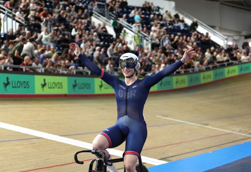 Lauren Bell throws her hands in the air after winning gold in the Women's sprint final during day three of the Lloyds Bank British National Track Championships in Manchester.