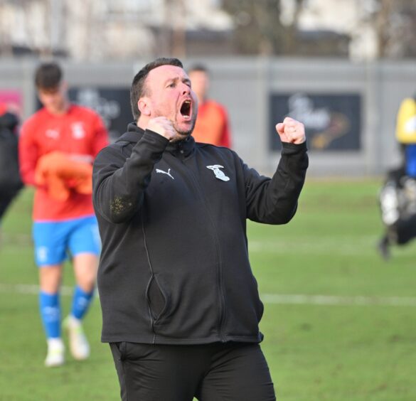 Inverness Caledonian Thistle head coach Scott Kellacher celebrates his team's late 1-0 win at Dumbarton in SPFL League One on March 8, 2025. 