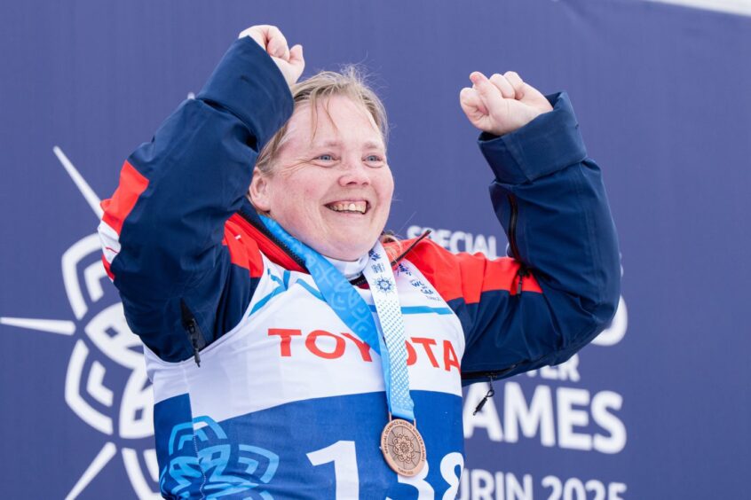 Emma Ronald wearing her bronze medals 