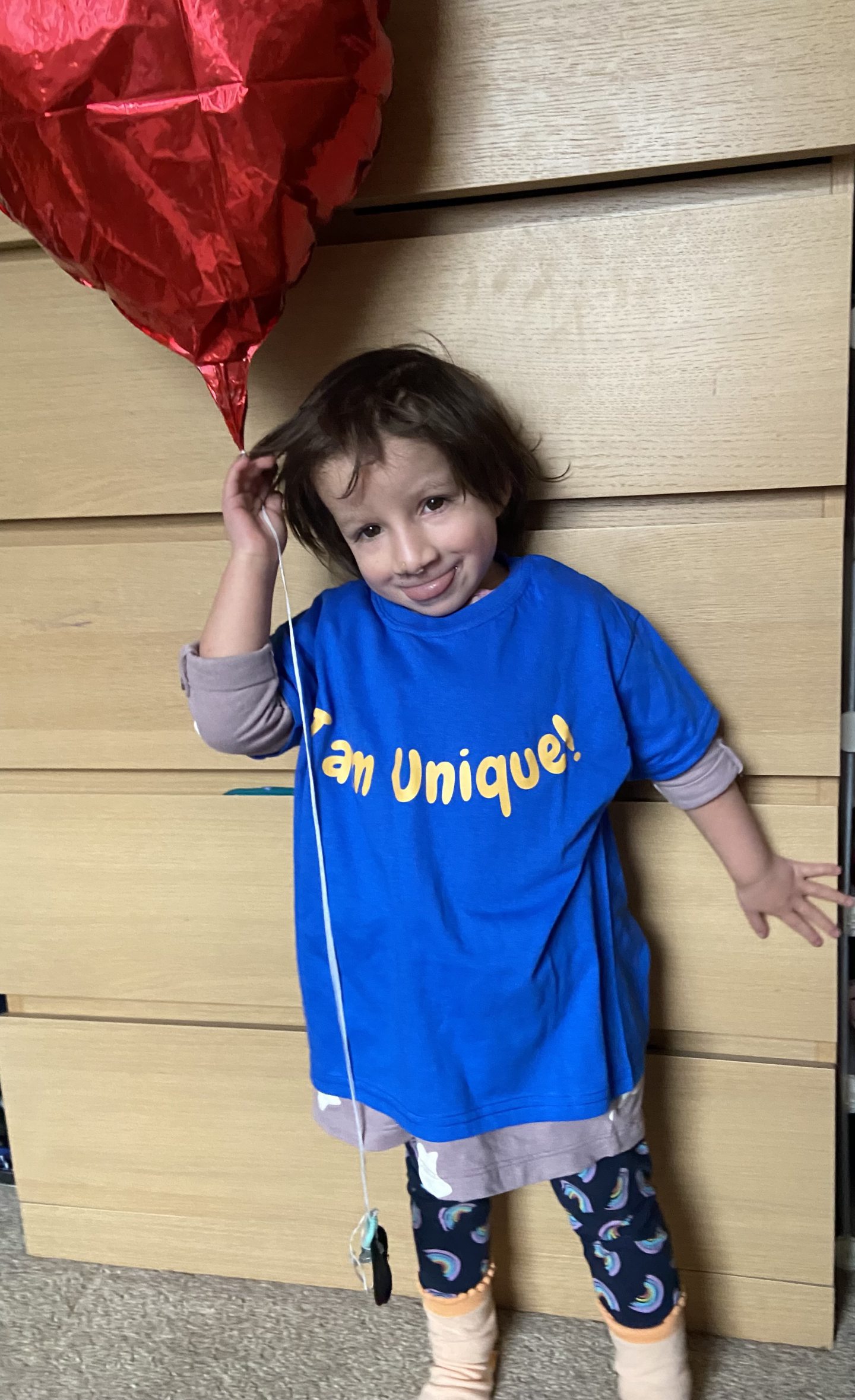 Tamaya wearing an "I am unique!" T-shirt 