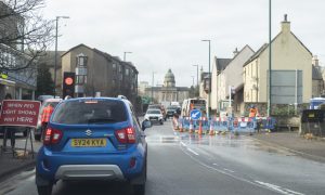 Temporary traffic lights have been installed on the A96 road. Image: Jason Hedges/DC Thomson.