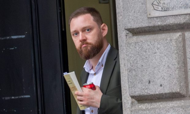 Aberdeen photographer accused of domestic abuse insists woman threw first punch