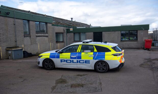 Police car outside industrial unit on Craigshaw Road