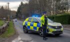 Police car and officer on South Deeside Road