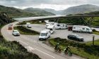 Motorhome users fill the car park next to Kylesku bridge on the NC500.