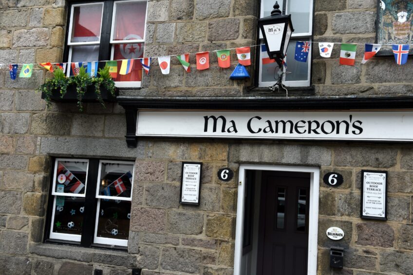 The outside of Ma Cameron's with different flag bunting.