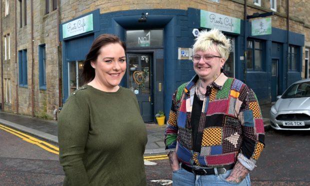 Rebecca and River outside Roots Cafe