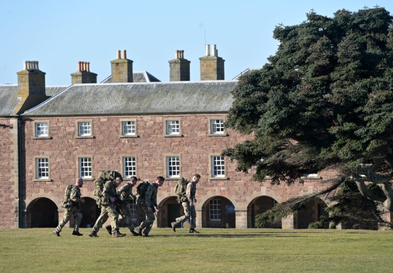 troops run around the perimeter of Fort George