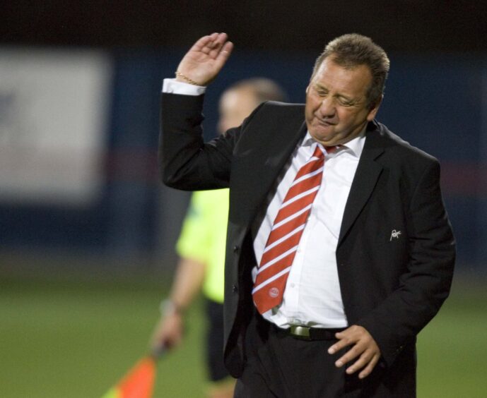 Aberdeen manager Jimmy Calderwood showed his disgust at his side's poor display. Image: SNS