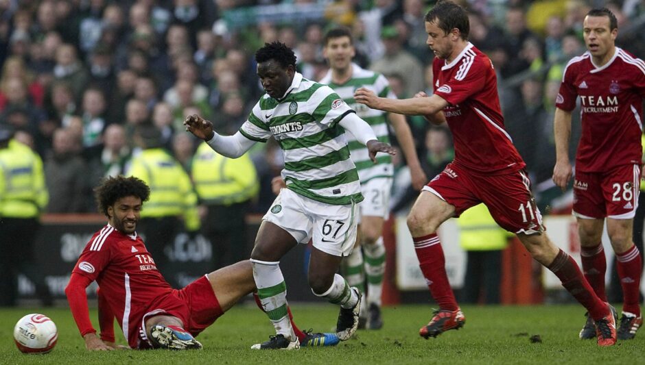 Celtic star Victor Wanyama causes problems for Youl Mawene (left) and Kari Arnason (right). Image: SNS.