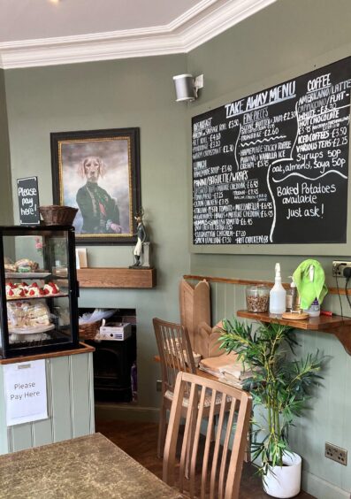 cafe interior with picture of a dog on the wall