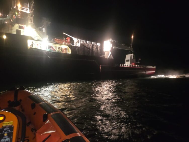 Lifeboat and cargo ship