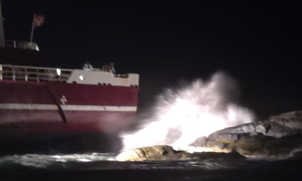 Cargo hitting waves and rocks