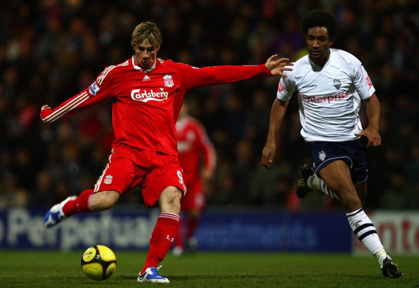 Fernando Torres of Liverpool shoots at goal as Youl Mawene of Preston North End closes in on January 3, 2009. Image: Shutterstock.