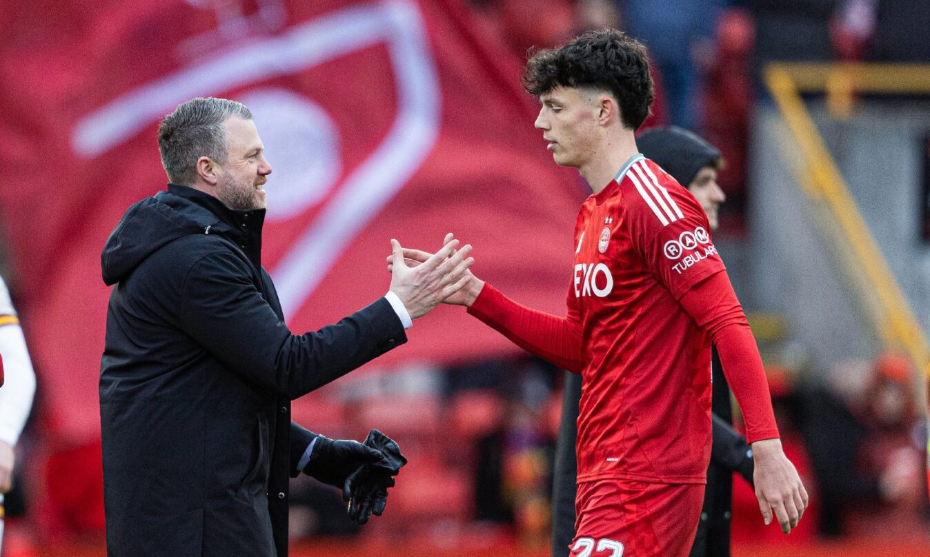 Aberdeen manager Jimmy Thelin (L) with Jack Milne at full time after the 4-1 win against Motherwell at Pittodrie. Image: SNS