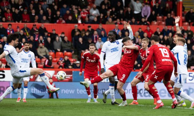 Aberdeen's Kevin Nisbet scores but the goal is ruled out for handball during a William Hill Premiership match between Aberdeen and Rangers at Pittodrie, on April 13, 2025. Image: SNS.